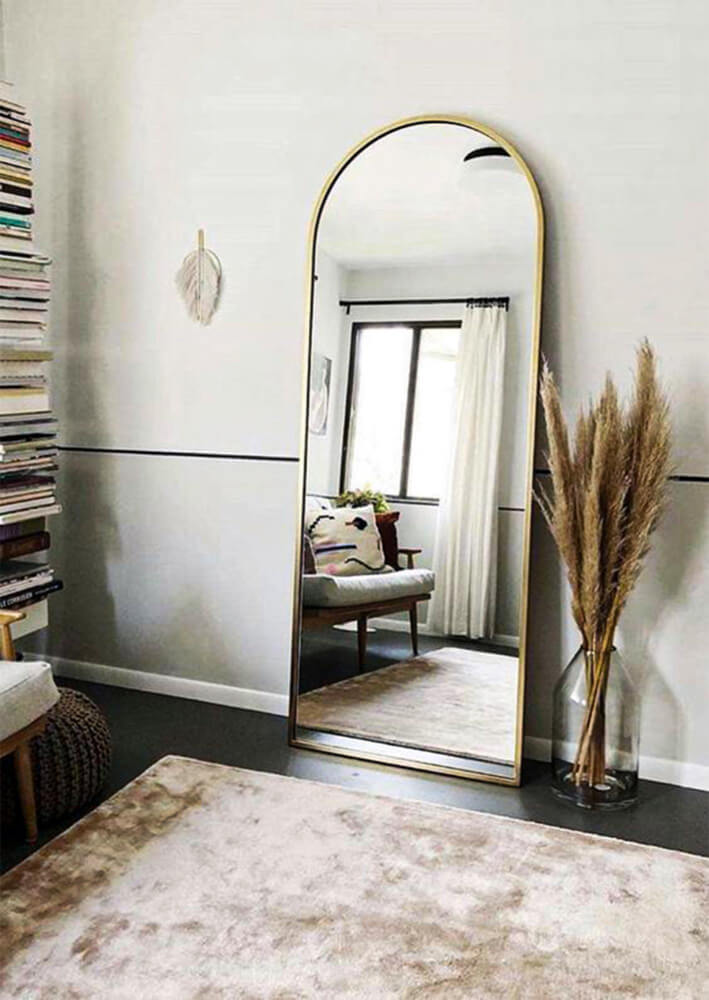 Large mirror leaning against the wall